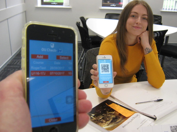 Demi Abrahams presenting her QR Code for scanning